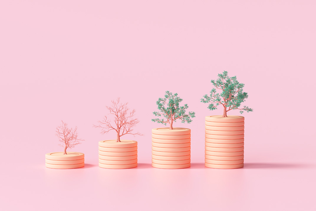 4 stacks of coins on a pink background, each stack larger than the previous with a tree gradually growing on each one